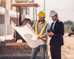 A general contractor reviewing blueprints for a home improvement project